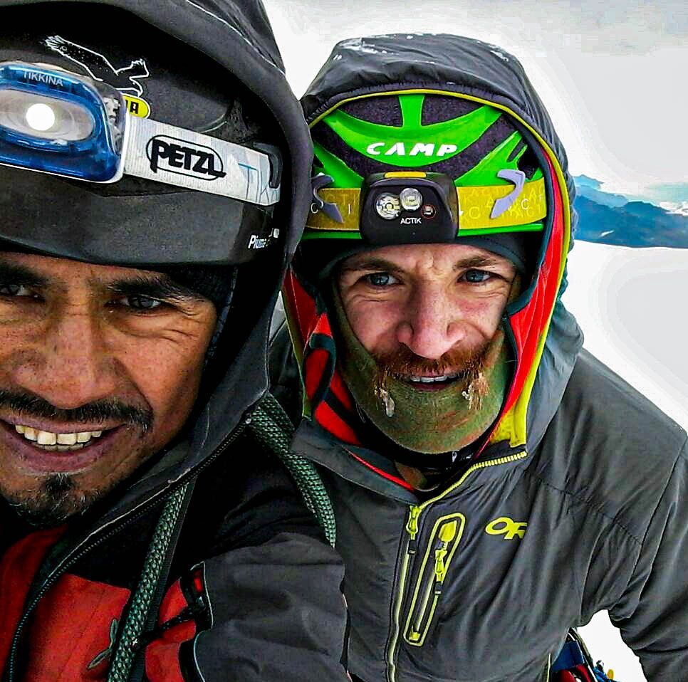 two men with helmet on mountain